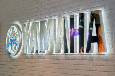 Yamaha brand inscription and logo on the wall of a musical instrument storeのeditorial素材
