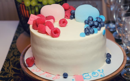 Cake on the table to determine the sex of the child, close-up. Home gender party to find out who will be born a boy or a girlの写真素材