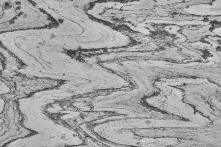Rock texture with curved lines. Background old stone surface.