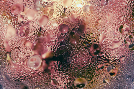 Red blurred abstract background with drops on glass