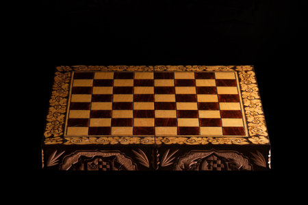 An empty chessboard with no chess pieces on a black backgroundの写真素材