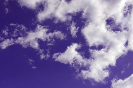White clouds on a dramatic dark sky, cloudscape copy space for text