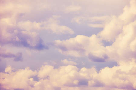 Blue sky background with clouds on a warm eveningの写真素材