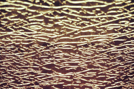 Brown background of cracks on broken glass, texture