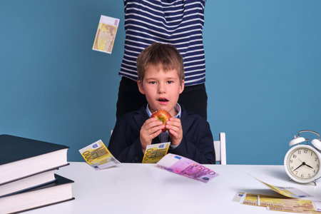 Money in euros for teaching children during school lessons. Concept of problems with money for food...