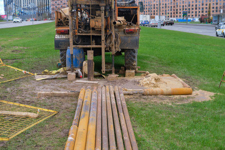 The drilling rig conducts engineering geological surveys on the city road - Moscow, Russia, April...