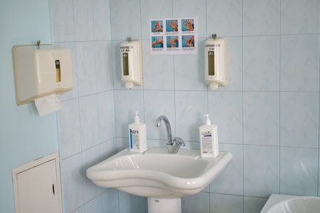 A sink with antiseptic and paper towels in the hospital - Russia, Moscow Region, June 23, 2021のeditorial素材