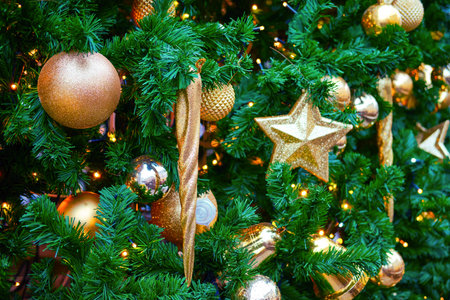 Candles and star as decoration for New Years celebration, close-up. Winter christmas tree in the...
