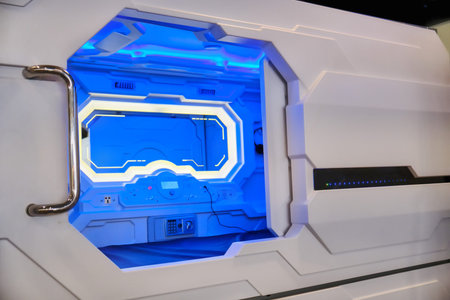 Blue light inside the room in capsule hotel. A place for the traveler to rest before the flight