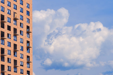 Unfinished modern high-rise houses against the blue sky