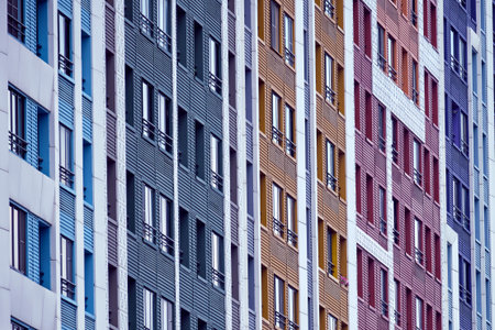 Windows on the facades of high-rise apartment buildings, close-up