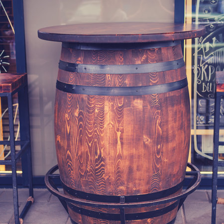 A wine barrel in the shape of a table in a cafe, close-up