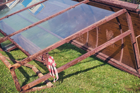 A public transport stop dumped on the ground, vandalism and damage to city property. The old stop to be replaced with a new, modern oneの写真素材