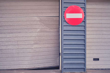 Damaged bent door that rises when opening a lift garageの写真素材