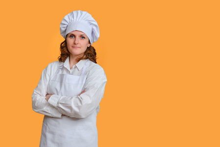 Happy woman chef on studio background, mockup copy spaceの写真素材