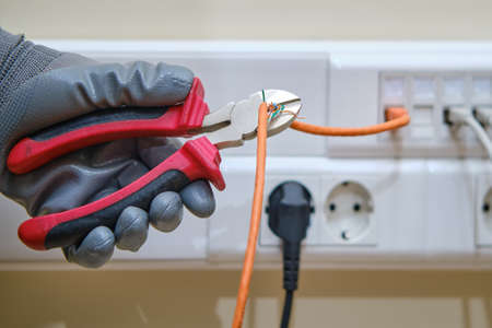 Cutting the computer network wire in the office in piecesの写真素材