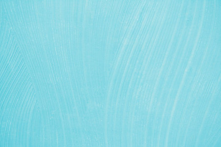 Blue wall texture with paint strokes, background