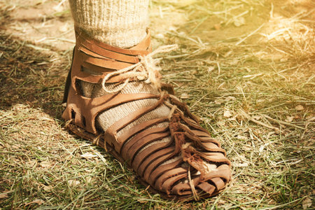 An ancient Roman man legs in caligae leather sandals. Reconstruction of the events of the Roman Empireの写真素材