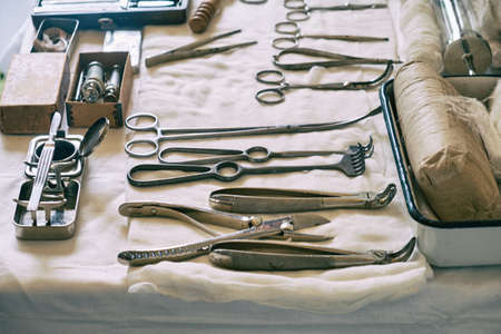 An old military field hospital with retro tents and vintage medical beds from the First World War. Mobile clinic for the treatment of soldiers of the early twentieth centuryの写真素材