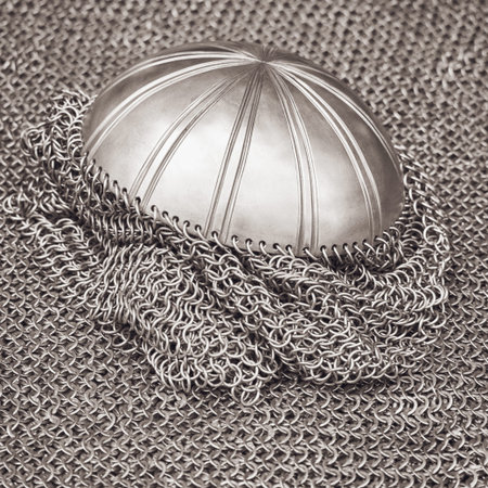 Vintage armor, retro chain mail and a protective metal helmet. Ancient military arsenal of the...