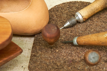Making medieval vintage leather shoes, items for creating retro boots. Reconstruction of the events...