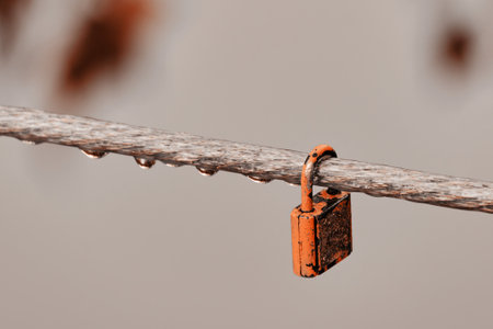 A small lock on a rope near the water of the river? close upの写真素材