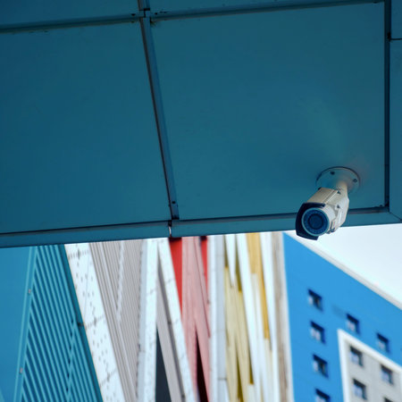 Outdoor surveillance security camera at the entrance of a residential building. CCTV camera on an...