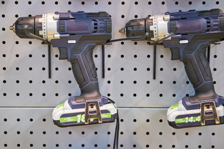A professional tool for work, repair and construction in the store. Sale of wired power tools and battery powered equipment in the shopの写真素材