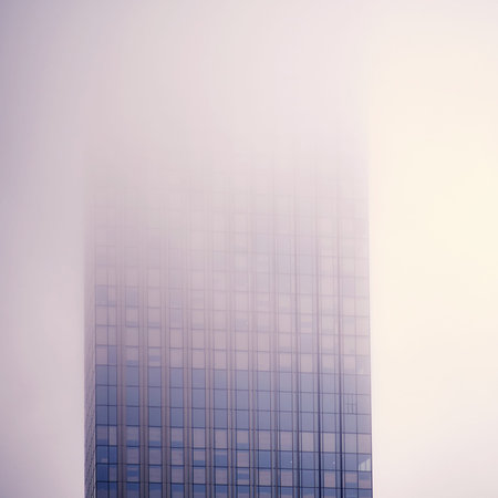 Windows of skyscrapers in the fog, background copy space. Metal structures with windows of a...