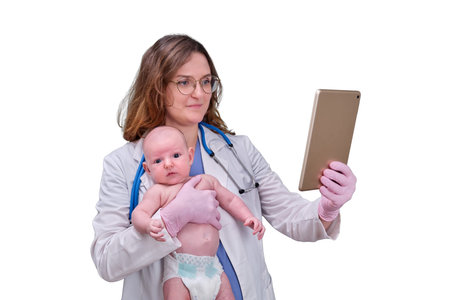 Pediatrician doctor holding tablet and newborn baby, isolated on a white background. Happy nurse in...
