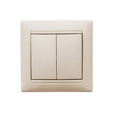Double switch on beige wall with wallpaper, copy space, isolated on a white backgroundの写真素材