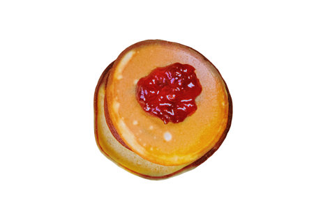 Pancakes with jam isolated on a white background. Baked pancakes for breakfastの写真素材