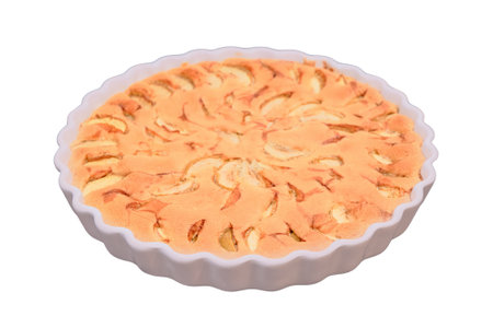 Home baking ripe apples, isolated on a white background. Apple pie with walnuts and almonds, isolated on a white background. Fruit cake with nutsの写真素材