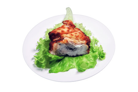 Meat cutlet with stuffing on a lettuce leaf, isolated on a white background. Plate on a dark wooden background.の写真素材