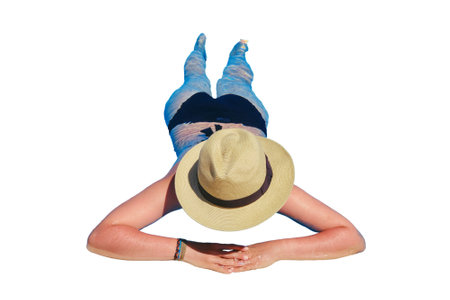 Woman in a straw hat near the edge of the pool, isolated on a white backgroundの写真素材