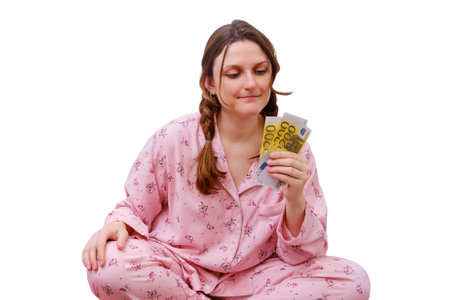 Portrait of an adult woman in red pajamas, isolated on a white backgroundの写真素材