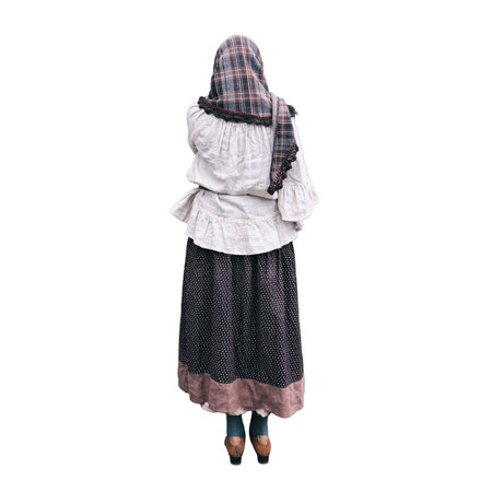A woman stands praying at the door of an old catholic church, isolated on a white backgroundの写真素材