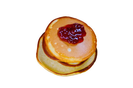 Pancakes with jam isolated on a white background. A hill of fresh pancakesの写真素材