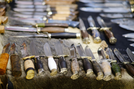 Many knives are laid out on the table. Army knives for the military, setの写真素材