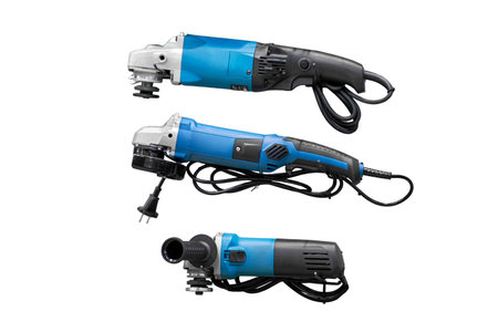 A professional tool for work, repair and construction in the store, isolated on white background. Sale of wired power tools and battery powered equipment in the shopの写真素材