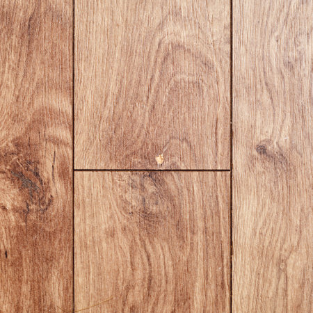 Getting started on fixing a hole in a laminate floorの写真素材