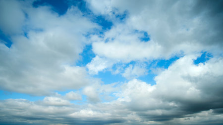 The overcast weather couldn't dampen the beauty of the cloudscape, as white clouds continued to roll in against the gray backdrop.の写真素材