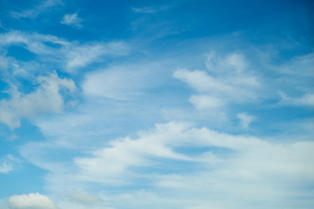 The cloudscape in the daytime sky was constantly changing, creating a dynamic and ever-evolving environment.の写真素材