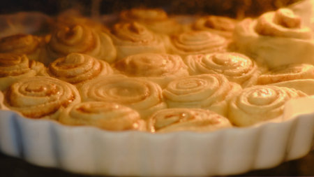 The process of cooking cinnamon rolls in the oven in the home kitchen