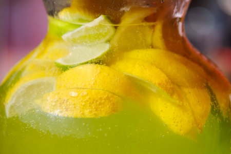 Detox citrus infused water, refreshing summer drink with lime and lemonの写真素材