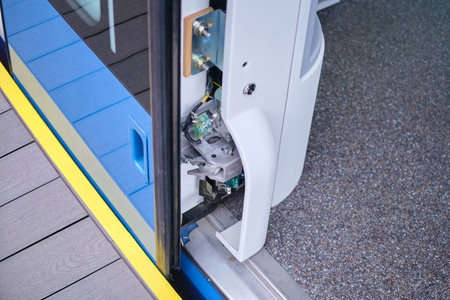 The mechanism of closing and opening doors in a subway train car/ Close-up detail of a modern...
