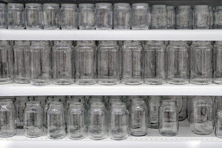 Glass jars on the shelf in the store, transparent background
