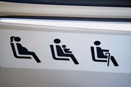 Interior with seats for disabled people, passengers with children and pregnant women in public transport - Moscow, Russia, August 30, 2023のeditorial素材