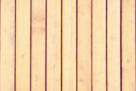 The texture of the treated wooden surface made of boards. Large wooden wall backgroundの写真素材
