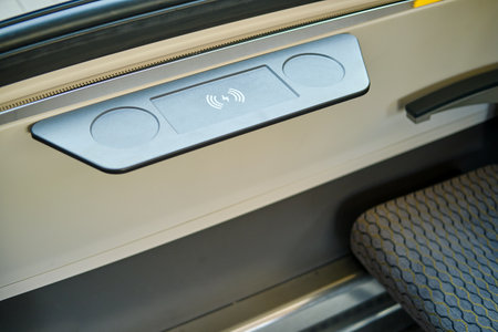 Wireless phone charging as an interior detail of public passenger transportの写真素材